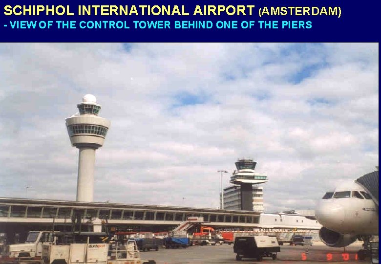 SCHIPHOL INTERNATIONAL AIRPORT (AMSTERDAM) - VIEW OF THE CONTROL TOWER BEHIND ONE OF THE