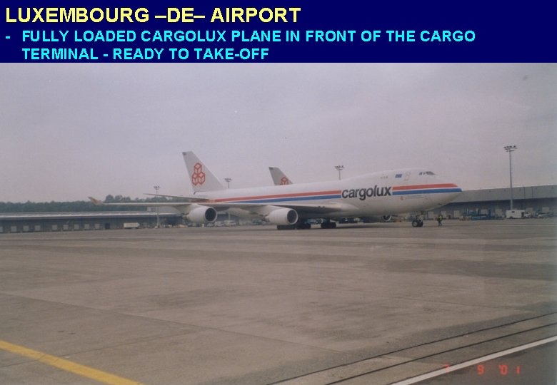 LUXEMBOURG –DE– AIRPORT - FULLY LOADED CARGOLUX PLANE IN FRONT OF THE CARGO TERMINAL