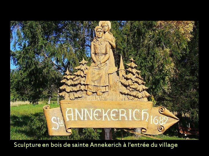 Sculpture en bois de sainte Annekerich à l'entrée du village 