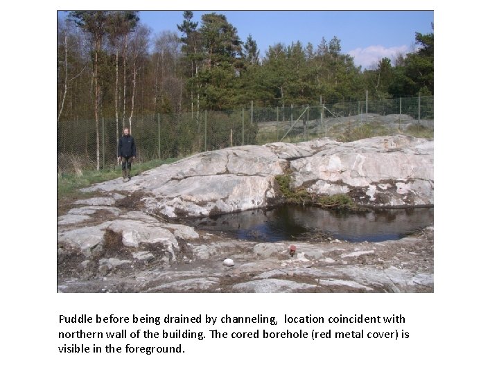 Puddle before being drained by channeling, location coincident with northern wall of the building.