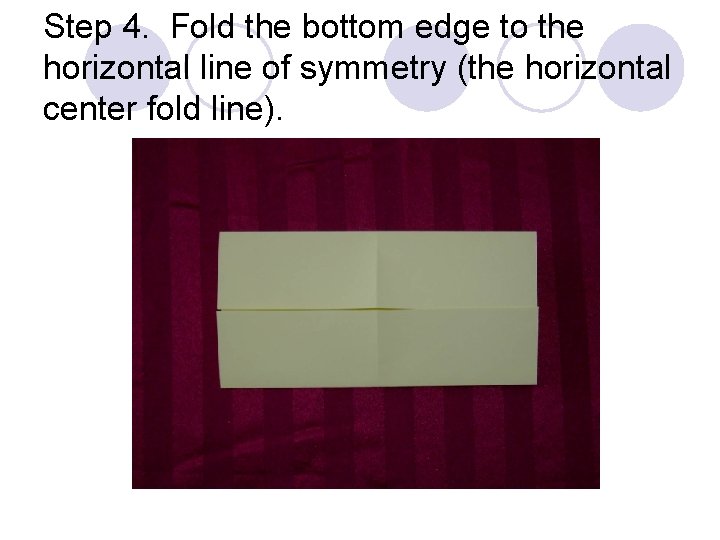 Step 4. Fold the bottom edge to the horizontal line of symmetry (the horizontal