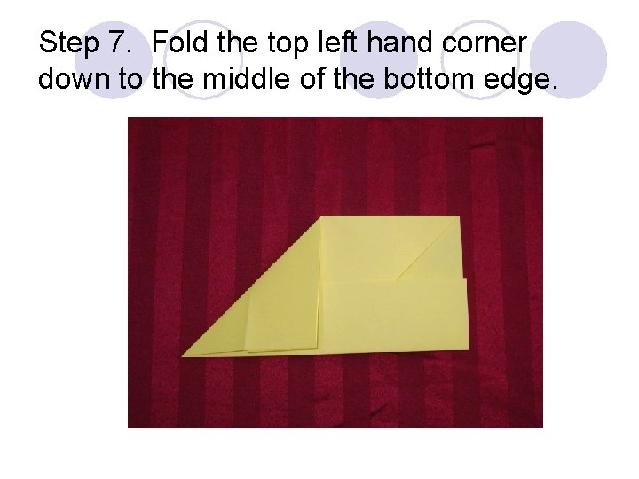 Step 7. Fold the top left hand corner down to the middle of the