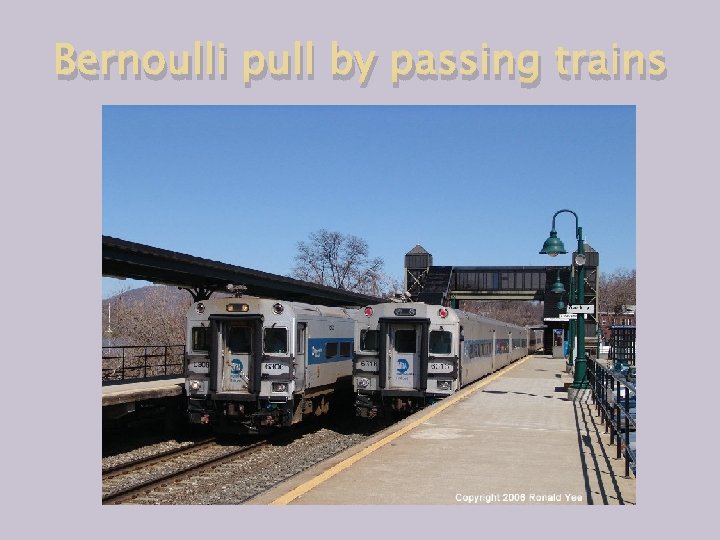 Bernoulli pull by passing trains 