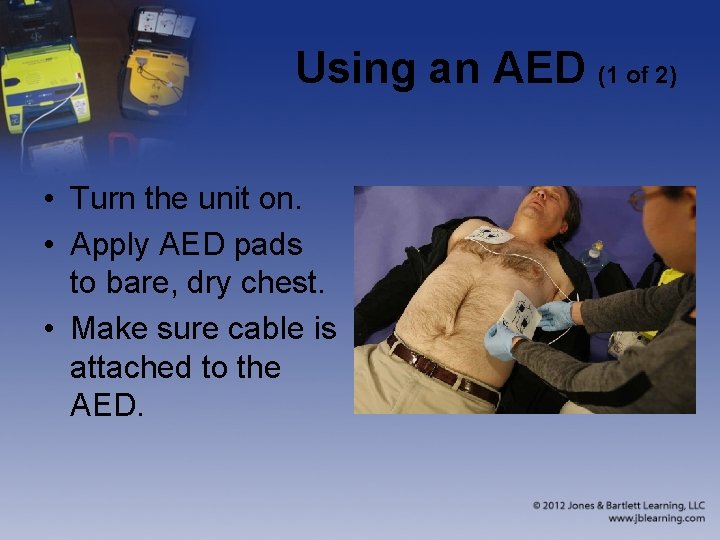 Using an AED (1 of 2) • Turn the unit on. • Apply AED