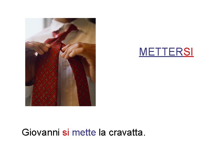 METTERSI Giovanni si mette la cravatta. 