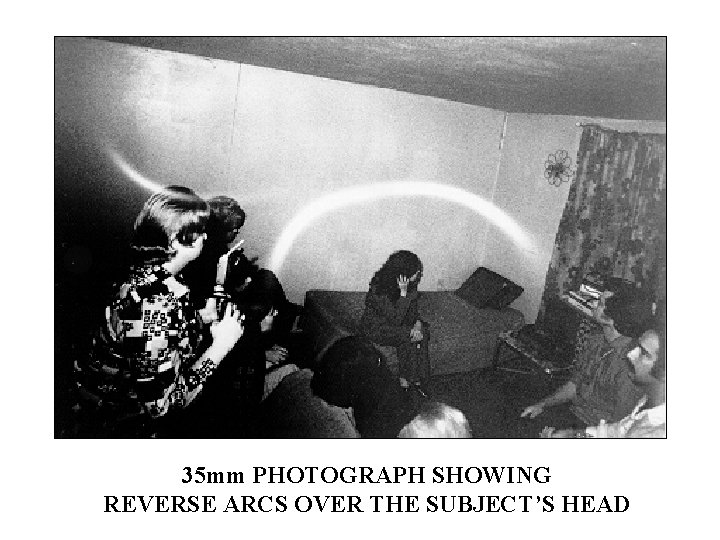 35 mm PHOTOGRAPH SHOWING REVERSE ARCS OVER THE SUBJECT’S HEAD 