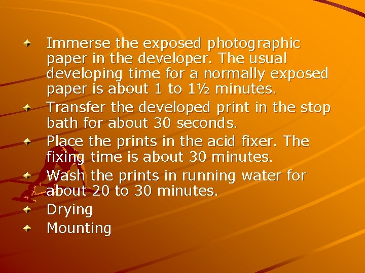 Immerse the exposed photographic paper in the developer. The usual developing time for a