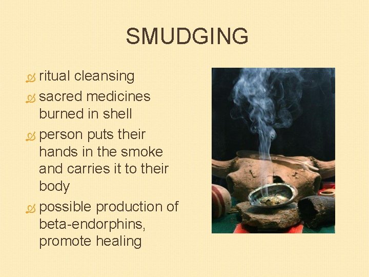 SMUDGING ritual cleansing sacred medicines burned in shell person puts their hands in the