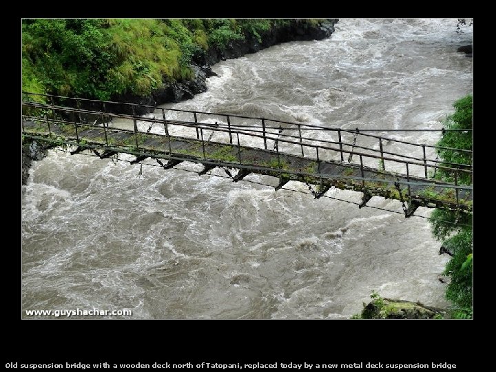 Old suspension bridge with a wooden deck north of Tatopani, replaced today by a