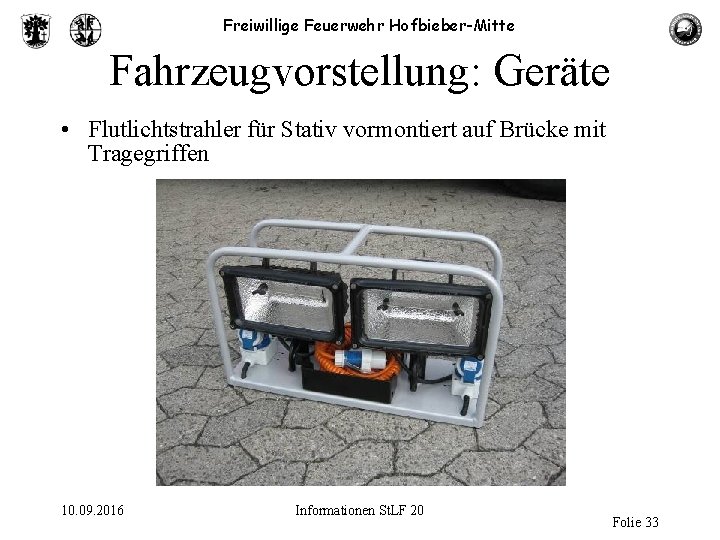 Freiwillige Feuerwehr Hofbieber-Mitte Fahrzeugvorstellung: Geräte • Flutlichtstrahler für Stativ vormontiert auf Brücke mit Tragegriffen