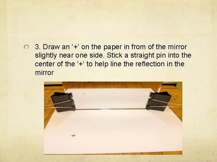 3. Draw an ‘+’ on the paper in from of the mirror slightly near