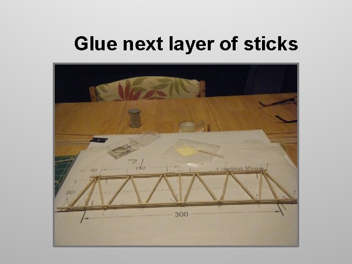 Glue next layer of sticks Glue next layer of sticks