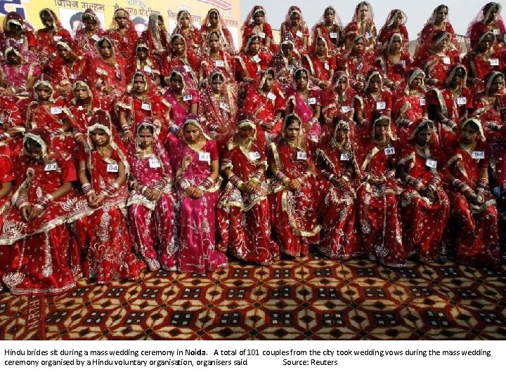 Hindu brides sit during a mass wedding ceremony in Noida. A total of 101