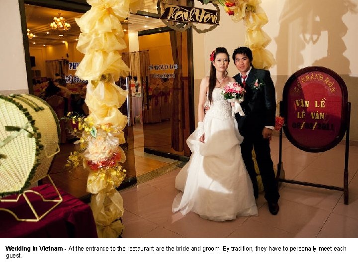 Wedding in Vietnam - At the entrance to the restaurant are the bride and