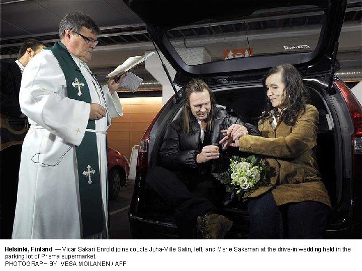 Helsinki, Finland — Vicar Sakari Enrold joins couple Juha-Ville Salin, left, and Merle Saksman