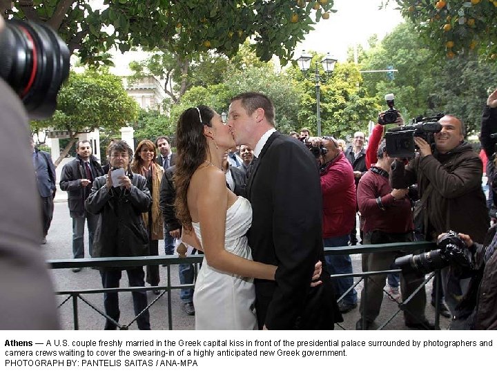 Athens — A U. S. couple freshly married in the Greek capital kiss in