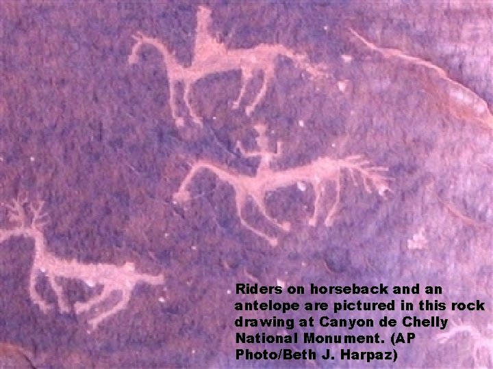 Riders on horseback and an antelope are pictured in this rock drawing at Canyon