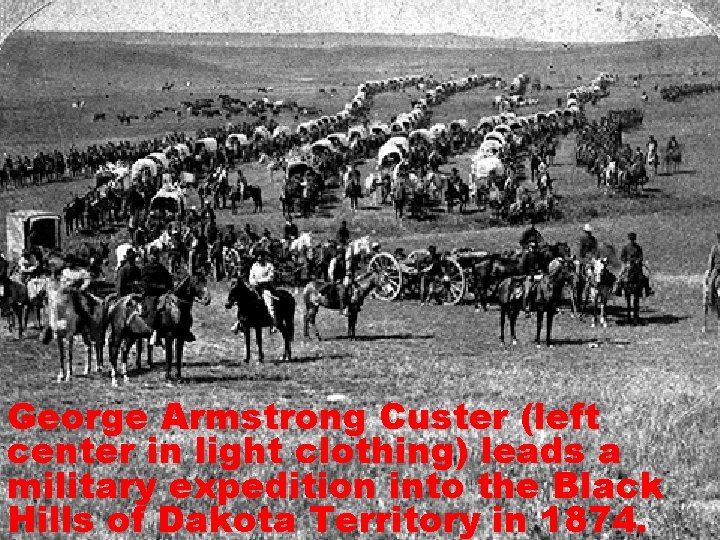 George Armstrong Custer (left center in light clothing) leads a military expedition into the