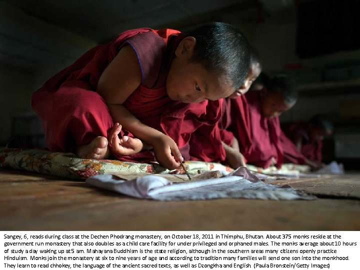 Sangey, 6, reads during class at the Dechen Phodrang monastery, on October 18, 2011