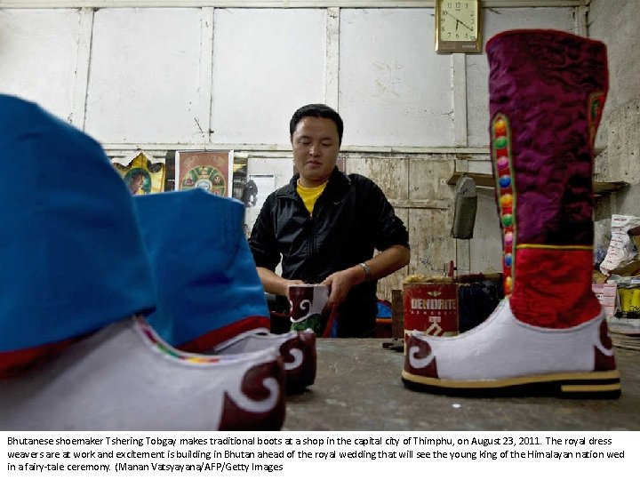 Bhutanese shoemaker Tshering Tobgay makes traditional boots at a shop in the capital city