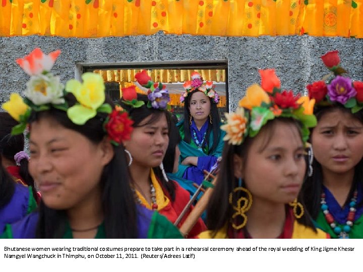 Bhutanese women wearing traditional costumes prepare to take part in a rehearsal ceremony ahead