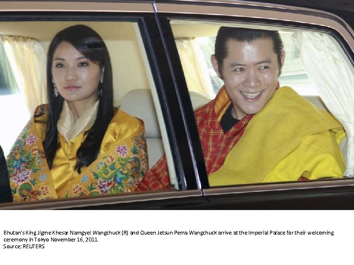 Bhutan's King Jigme Khesar Namgyel Wangchuck (R) and Queen Jetsun Pema Wangchuck arrive at