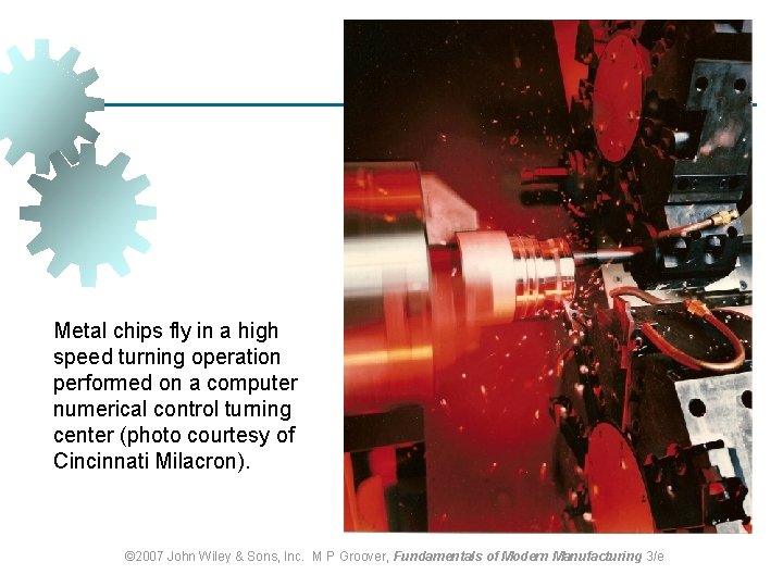 Metal chips fly in a high speed turning operation performed on a computer numerical