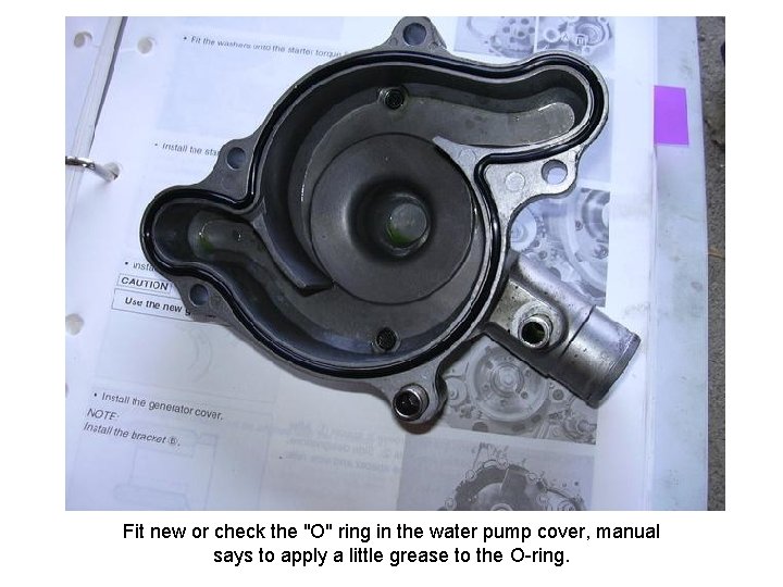 Fit new or check the "O" ring in the water pump cover, manual says