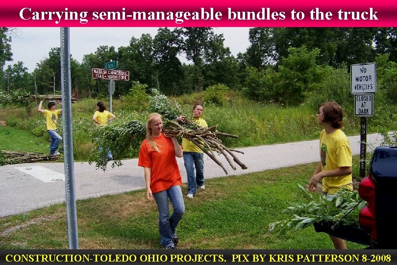Carrying semi-manageable bundles to the truck CONSTRUCTION-TOLEDO OHIO PROJECTS. PIX BY KRIS PATTERSON 8