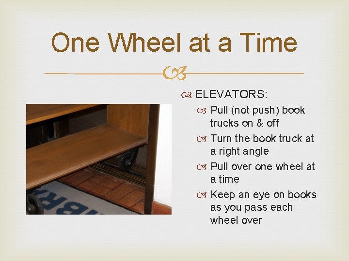 One Wheel at a Time ELEVATORS: Pull (not push) book trucks on & off