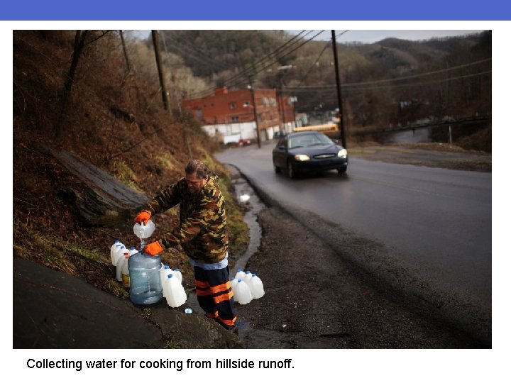 Collecting water for cooking from hillside runoff. 