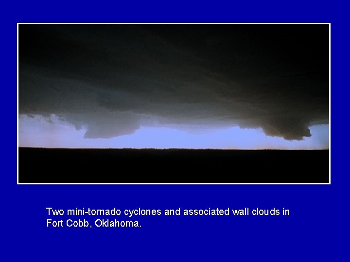 Two mini-tornado cyclones and associated wall clouds in Fort Cobb, Oklahoma. 