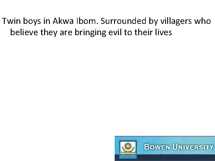 Twin boys in Akwa Ibom. Surrounded by villagers who believe they are bringing evil