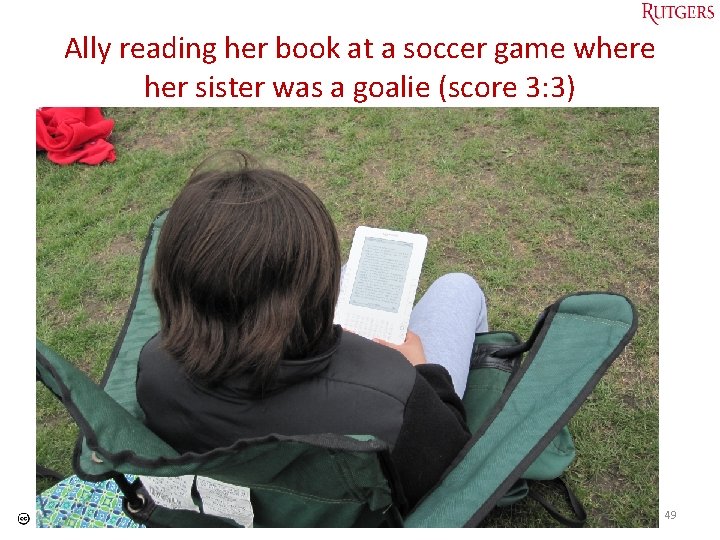 Ally reading her book at a soccer game where her sister was a goalie