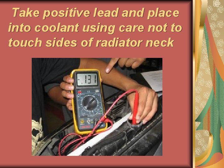 Take positive lead and place into coolant using care not to touch sides of