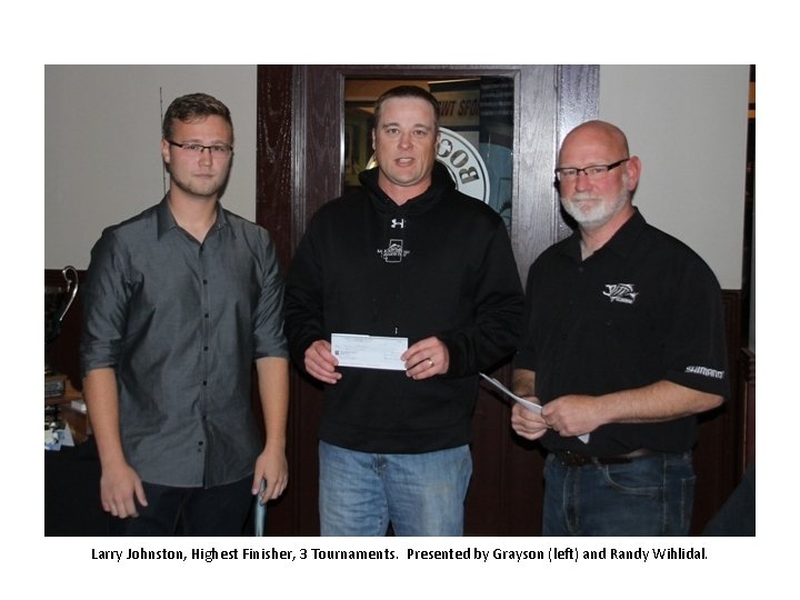 Larry Johnston, Highest Finisher, 3 Tournaments. Presented by Grayson (left) and Randy Wihlidal. 