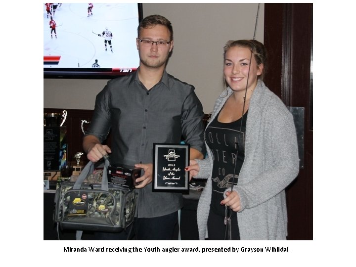 Miranda Ward receiving the Youth angler award, presented by Grayson Wihlidal. 