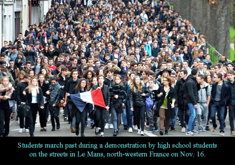 Students march past during a demonstration by high school students on the streets in