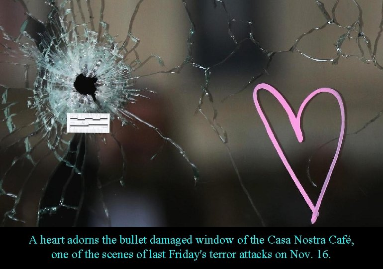 A heart adorns the bullet damaged window of the Casa Nostra Café, one of