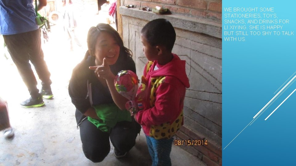 WE BROUGHT SOME STATIONERIES, TOYS, SNACKS, AND DRINKS FOR LI XIYING. SHE IS HAPPY