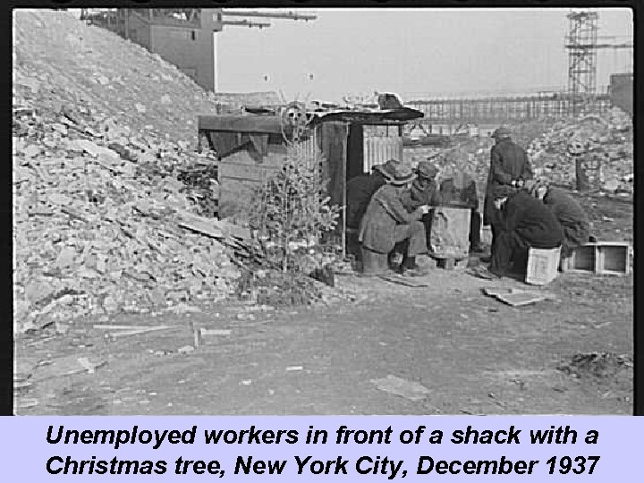 Unemployed workers in front of a shack with a Christmas tree, New York City,