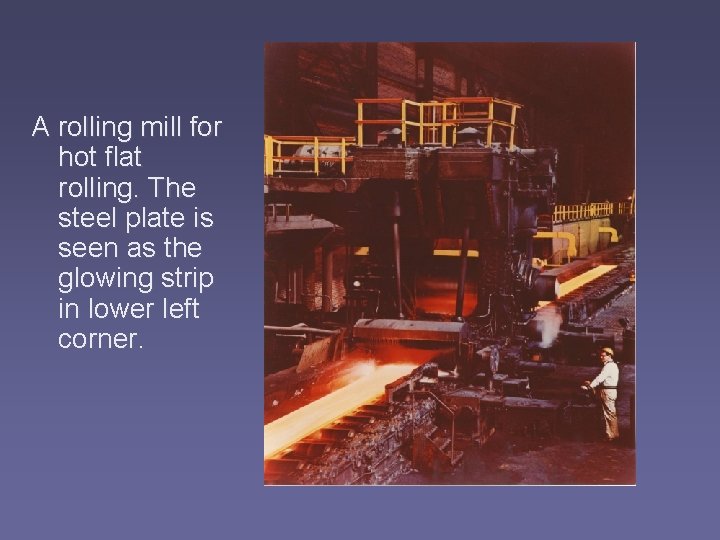 A rolling mill for hot flat rolling. The steel plate is seen as the