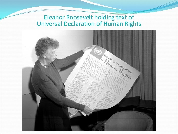 Eleanor Roosevelt holding text of Universal Declaration of Human Rights 