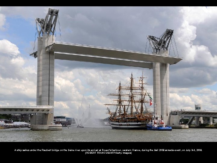 A ship sailes under the Flaubert bridge on the Seine river upon its arrival