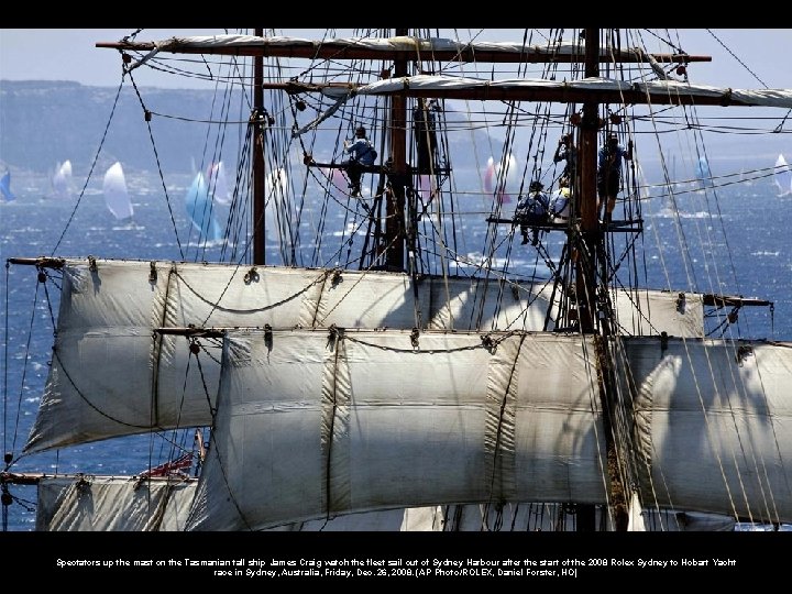 Spectators up the mast on the Tasmanian tall ship James Craig watch the fleet