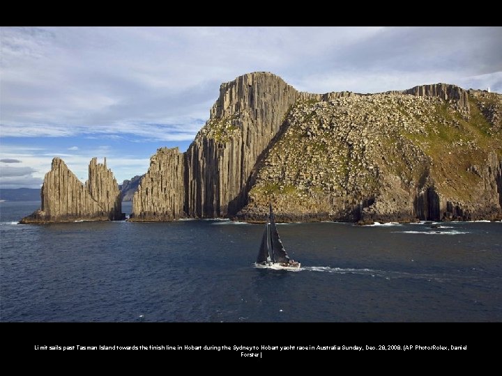 Limit sails past Tasman Island towards the finish line in Hobart during the Sydney