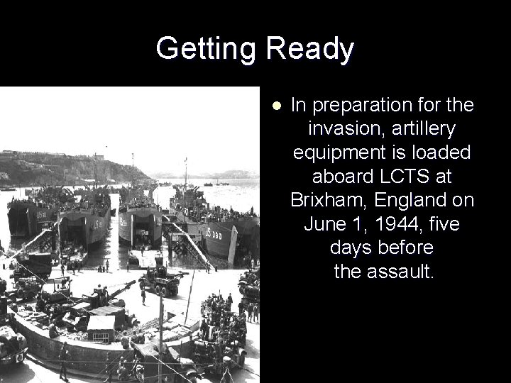 Getting Ready l In preparation for the invasion, artillery equipment is loaded aboard LCTS