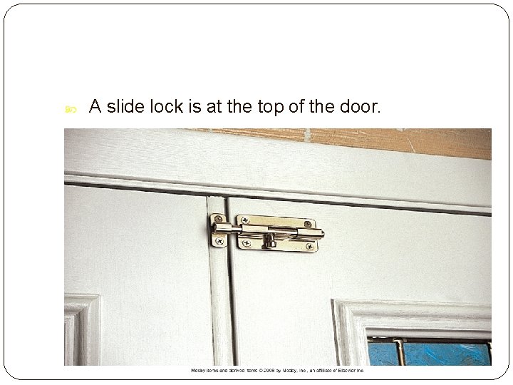  A slide lock is at the top of the door. Slide 29 