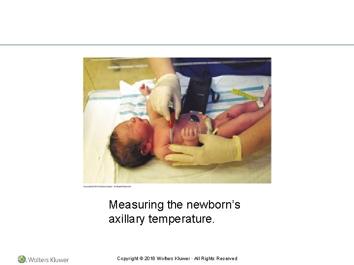 Measuring the newborn’s axillary temperature. Copyright © 2018 Wolters Kluwer · All Rights Reserved