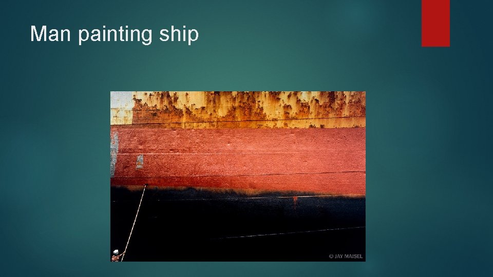 Man painting ship 